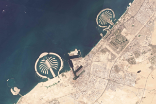 This Sept. 21, 2021 satellite photo by Planet Labs Inc. shows southern Dubai and its Jebel Ali port. The Jebel Ali village is now surrounded by developments. Nakheel, the state-owned developer of Dubai's signature palm-shaped islands, has unveiled plans to demolish the neighborhood to make way for a gated community of flashy, two-story villas. Residents of the village, which dates back to the late 1970s, have received eviction notices and say they're upset to leave the quiet neighborhood. (Planet Labs Inc. via AP)